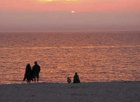 Sunset with bathers on beach - Lake Michigan