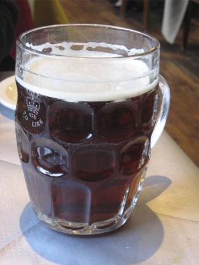 British_dimpled_glass_pint_jug_with_ale-380px-hi