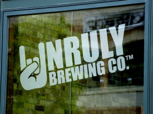 Unruly Brewing Company window logo - Muskegon, Michgian