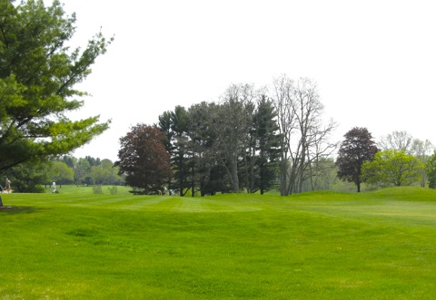Golf course with golfers in distance in early spring - west Michigan